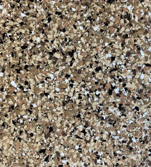 Close-up of tan and black flake epoxy floor