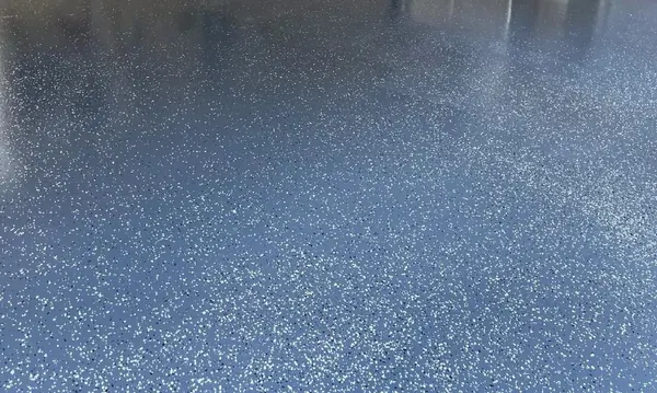 Glossy blue flake epoxy garage floor