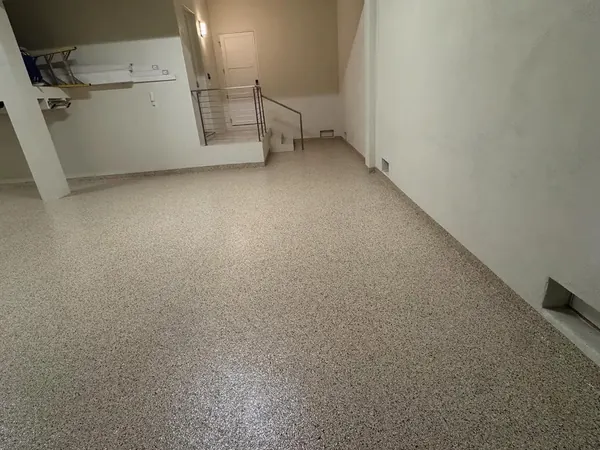 Lower-level garage tan flake epoxy floor